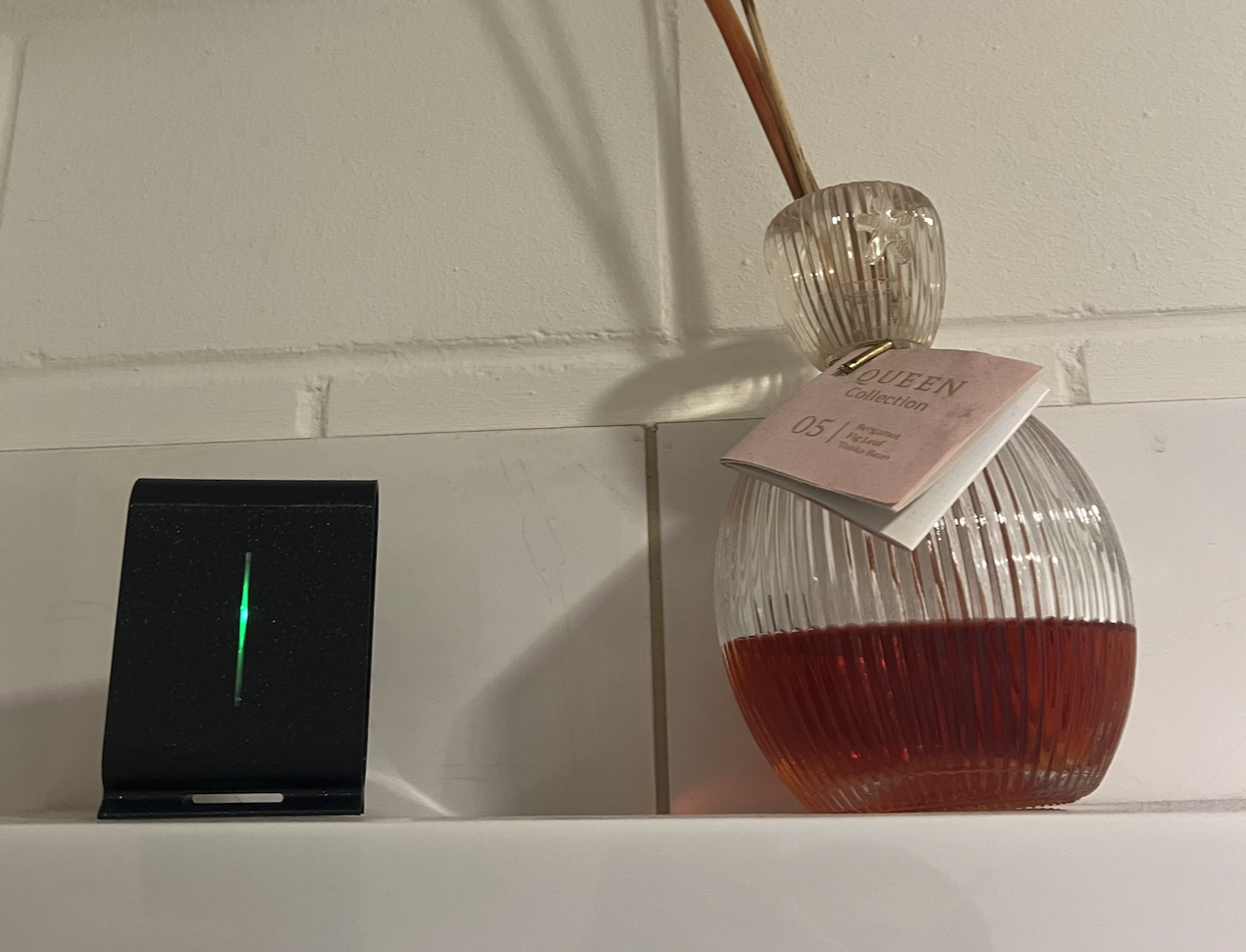 OAQ-1-2 air quality sensor deployed in a bathroom environment